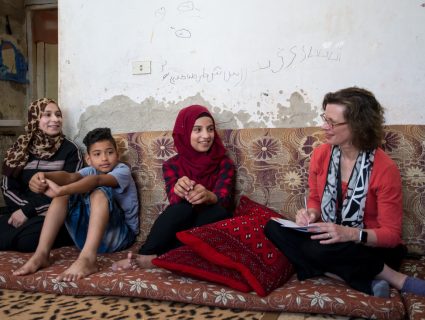 Michelle Nunn, president and CEO of CARE USA, meets with the family of young filmmaker Walaa, 15, and her brother who appears in the film, Nasr, 12, in Azraq town, Jordan on June 20, 2018. photo Carey Wagner/CARE